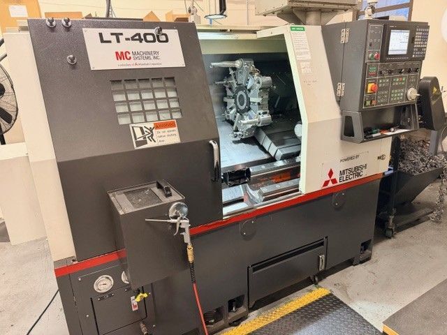 Mitsubishi #LT-400, CNC lathe, 15.7" swing, 25.39" machining length, 8.5" turning diameter, 8" chuck, 2" bar