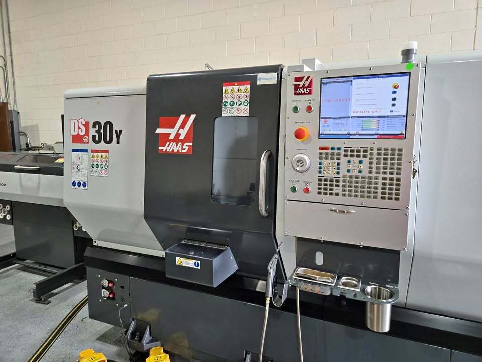 Haas #DS-30Y, 4-Axis CNC Lathe, 31.7" swing, 23" machining length, 18" turning diameter, 10" chuck, 3" bar