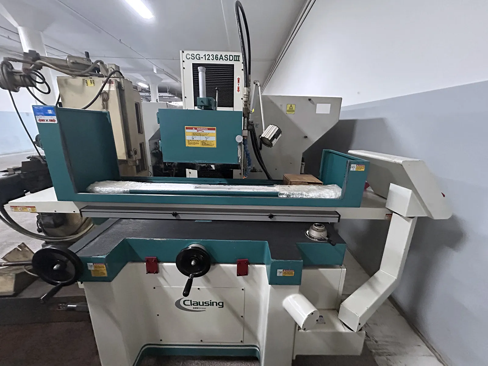 12" x 36" Clausing #CSG-1236ASDIII, automatic surface grinder, 24.8" spindle center to table, 37.8" long.
