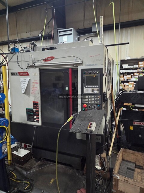 Samsung #SM400DH, Dual-Spindle CNC Vertical Machining Center, (4) double-lock 4" Teco vises, hydraulic
