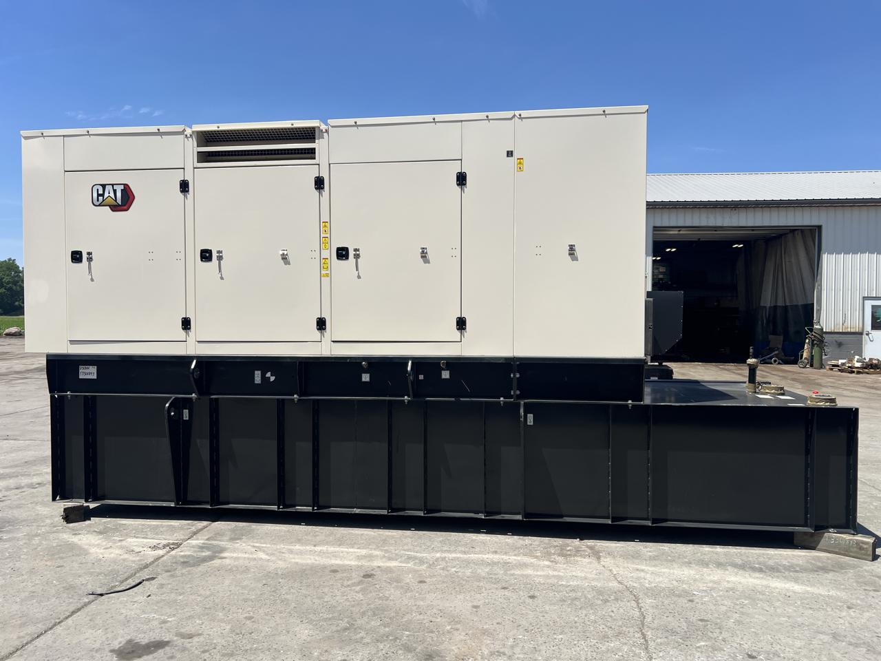 500 KW Caterpillar #C15, diesel generator set, 480 Volts, 1/3 phase, sound attenuated enclosure, 1200 gal.