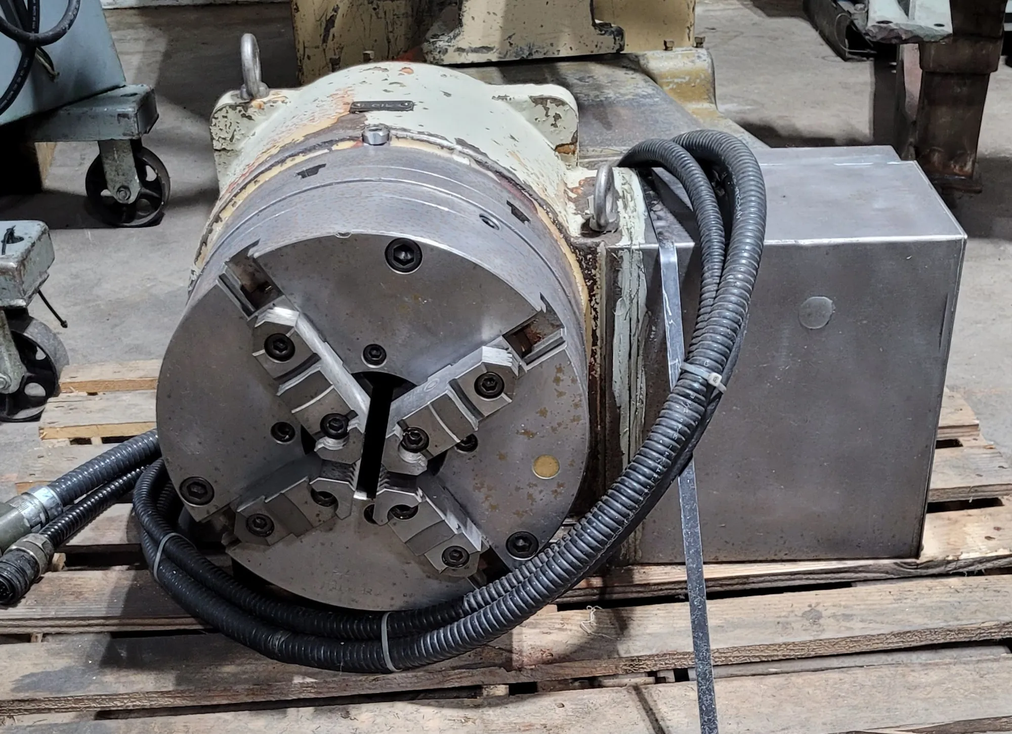 12.6" Yuasa #DMNC-32001, rotary table, 36 RPM, 550 lb. load capacity, 1.36 HP, 12" 4-jaw Bison chuck