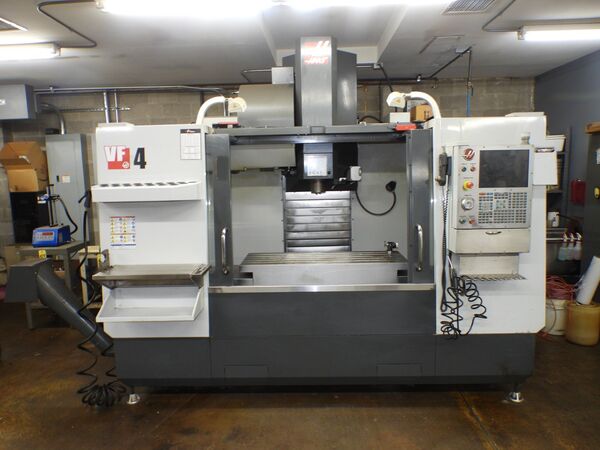Haas #VF-4, CNC vertical machining center, 24 automatic tool changer, 50" X, 20" Y, 25" Z, 8100 RPM, 30 HP