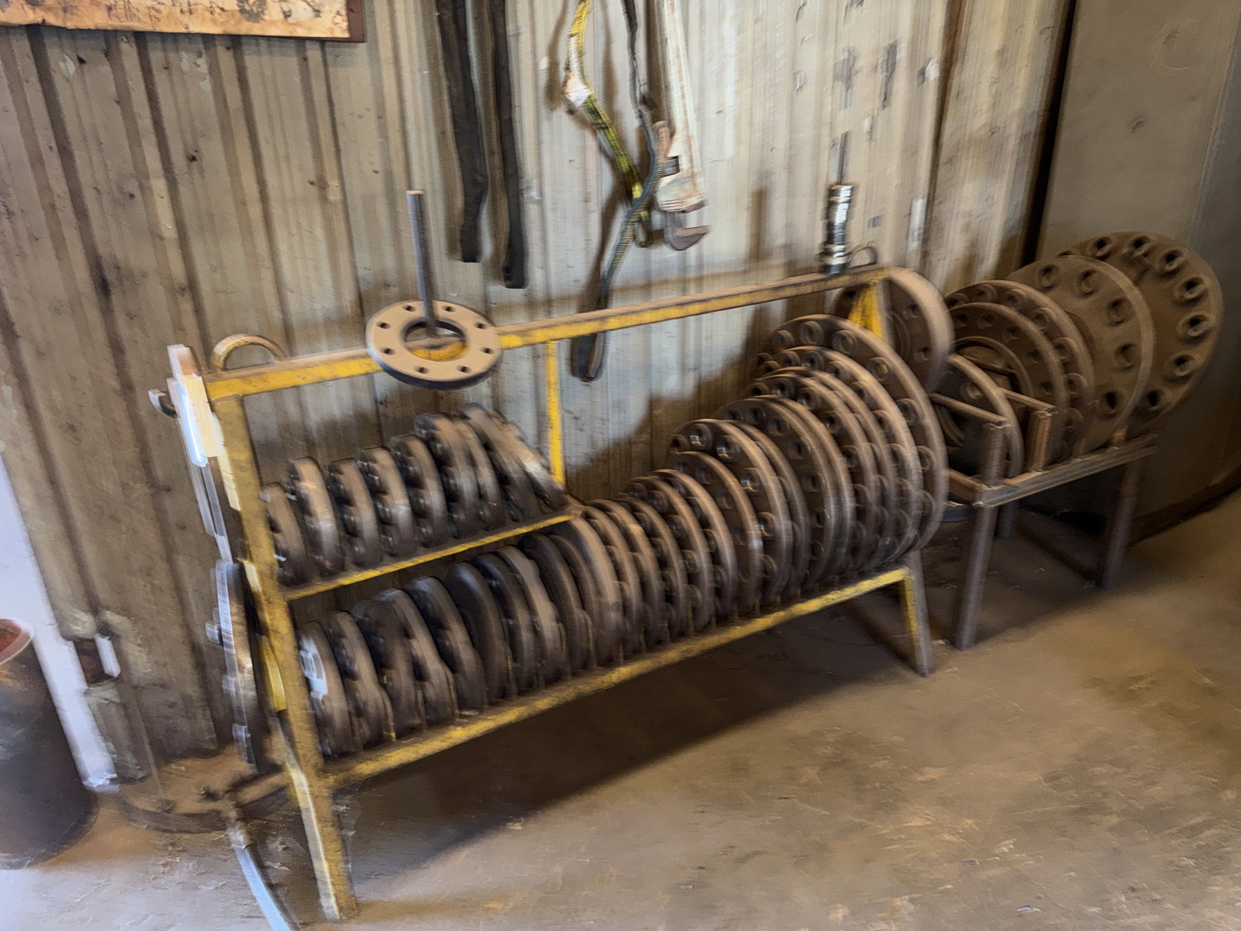 section of wellhead spacer flange racks w/ 25