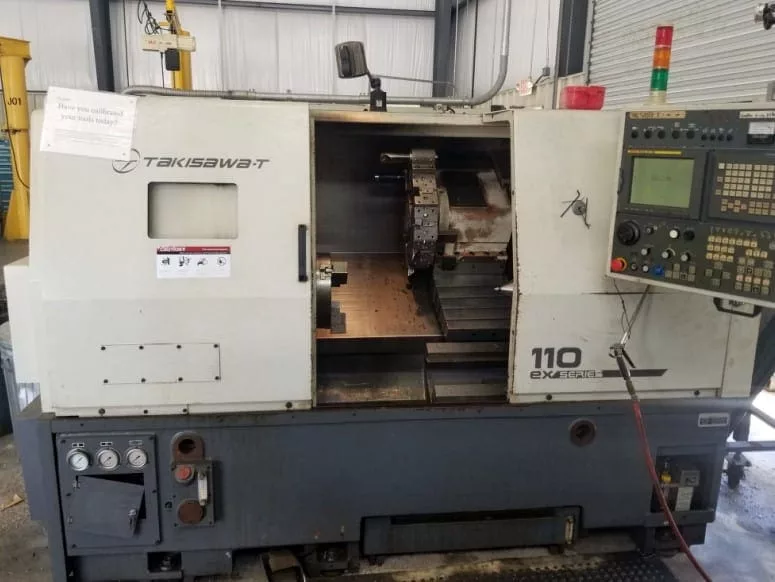 Takisawa #T-110EX, CNC Lathe, 19.5" swing, 28" centers, 12" chuck, 3" bar, 3500 RPM, 12-station turret, chip