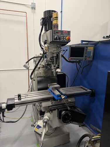 Kent #KTM-4VKF-E, CNC vertical bed mill, 12" x50" table, 30" X, 17" Y, 22" ram, 4" quill, 3 HP, 50-4500 RPM