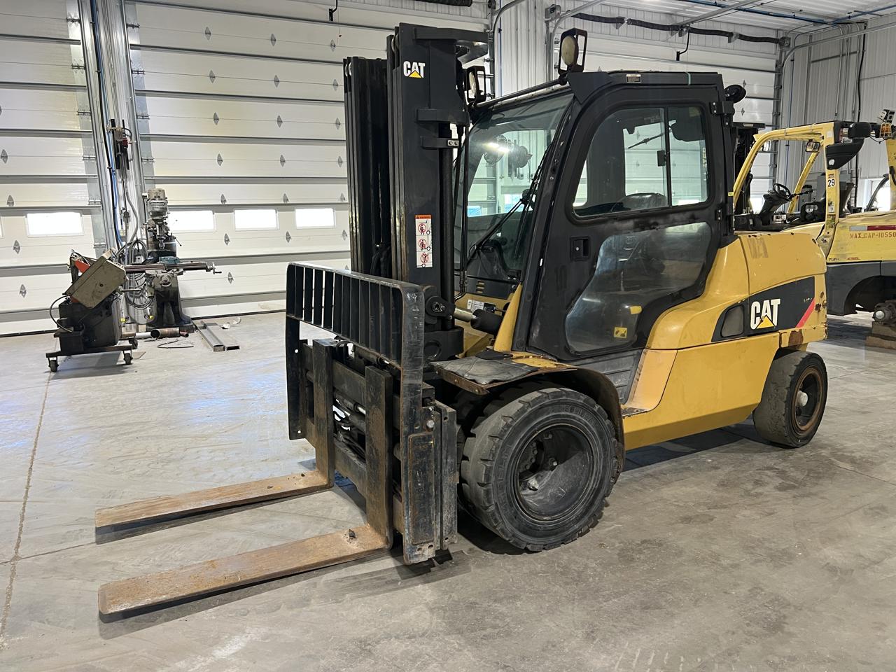 12,000 lb. Caterpillar #DP55N1, diesel forklift, 42" forks, triple stage mast, side shift, fork positioner