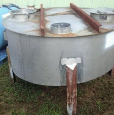 200 gallon Stainless Steel, flat top with a slant/sloped bottom, mounted on legs