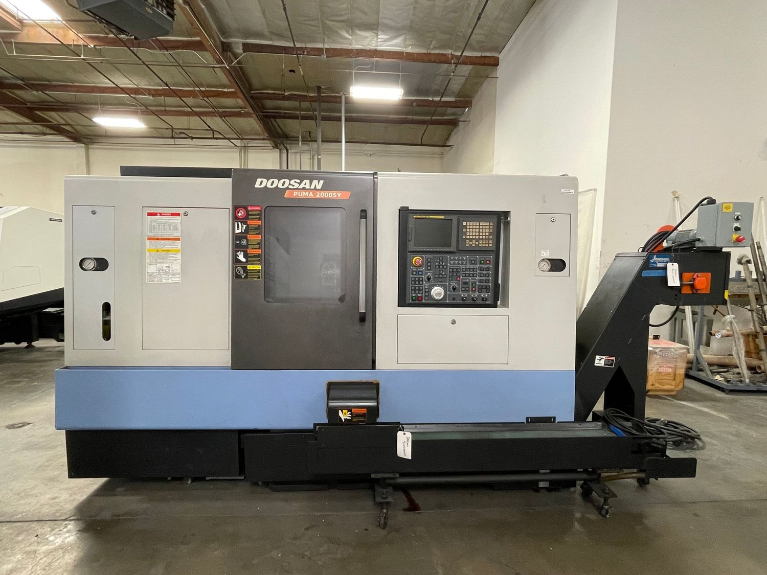 Daewoo Doosan #Puma-2000SY, CNC lathe, 8" chuck, 2.6" bar, 13" dia., 33" centers, 10 HP, 5000 RPM, 12 turret