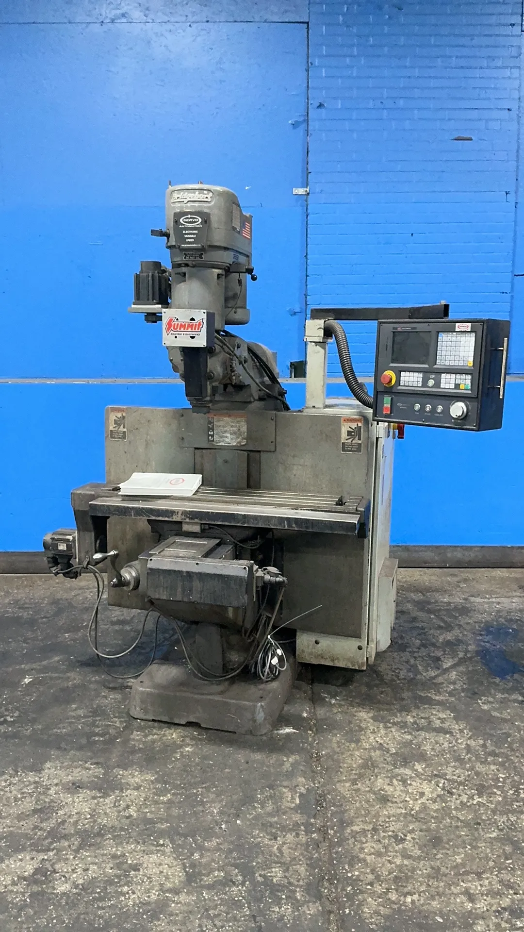 Bridgeport, CNC vertical mill, 9" x 42" table, 2 HP, servo controller, manual, 3 Ph., 240 V.