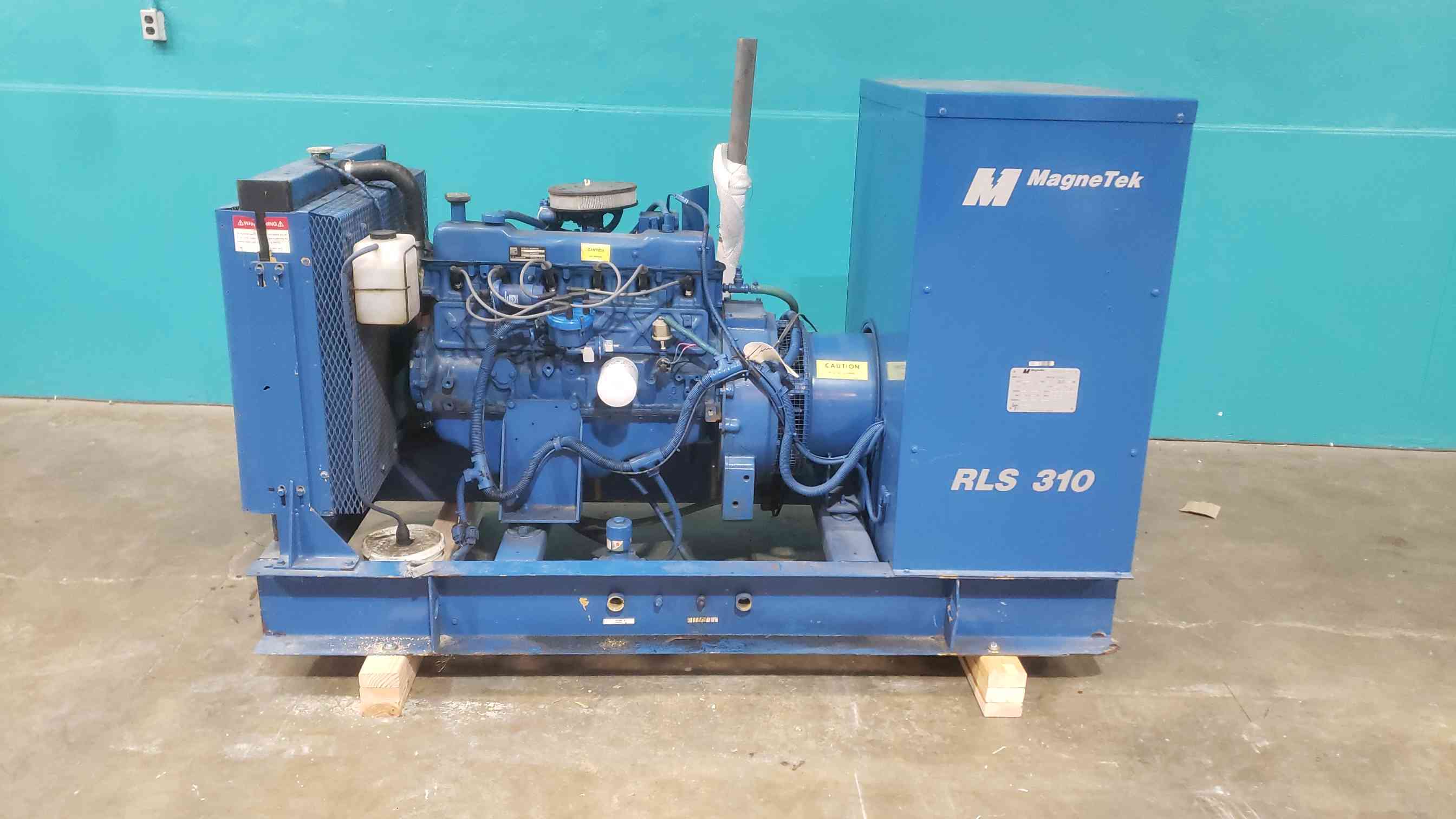 25 KW MagneTek #RLS-310, LP/NG generator set, 120/240 Volts, 104 A, AS IS
