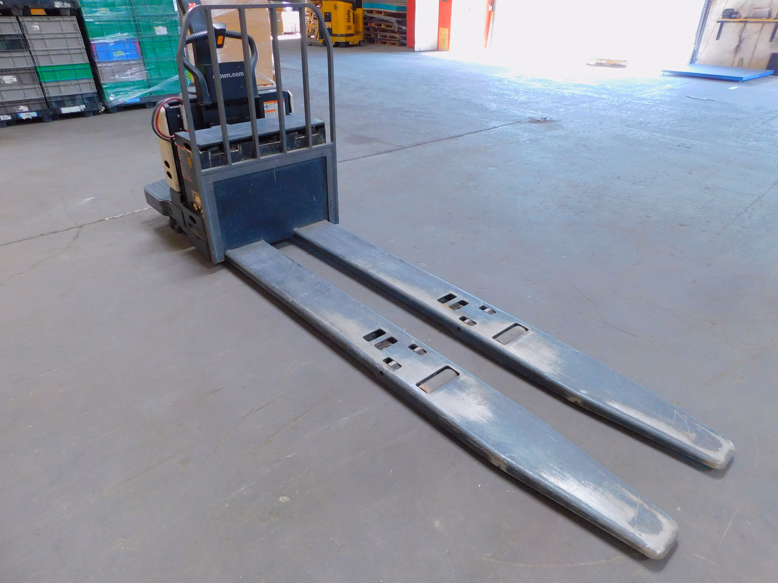 6000 lb. Crown #PE4500-60, electric rider pallet jack, 96" forks, 24 V., power steering, 2520 hours