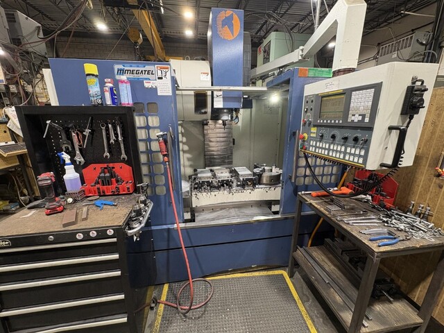 Takumi #V10, CNC vertical machining center, 40" X, 26" Y, 24" Z, 42" x 26" table, 10000 RPM, BT 40, side