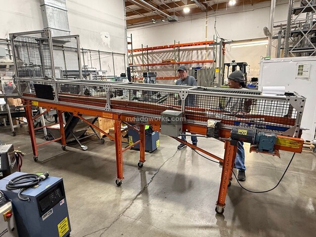 EMI, Belt Conveyor, aluminum extrusion frame, wire mesh side & hood guarding, telescoping legs on casters