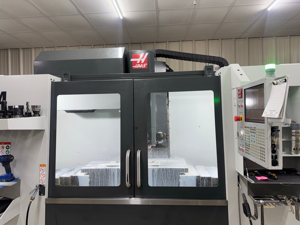 Haas #VF-4, CNC vertical machining center, 50" X, 20" Y, 25" Z, 8100 RPM, 30 HP, 30 automatic tool changer
