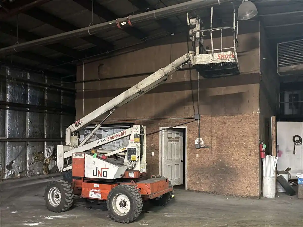 500 lb. Snorkel #UNO-33E, articulating lift, 32' 8" lift height, foam filled tires, 48 VDC, battery powered