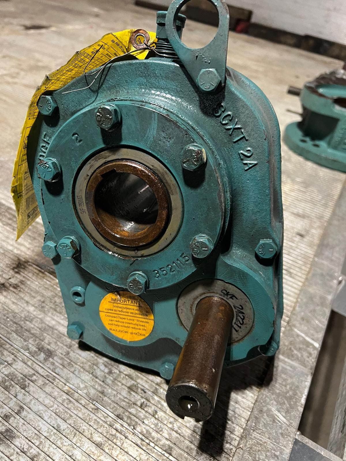 Dodge #SCXT225A, Torque-Arm II screw conveyor shaft mount reducer, 8.42 HP, 1994 RPM max input, 23.46:1