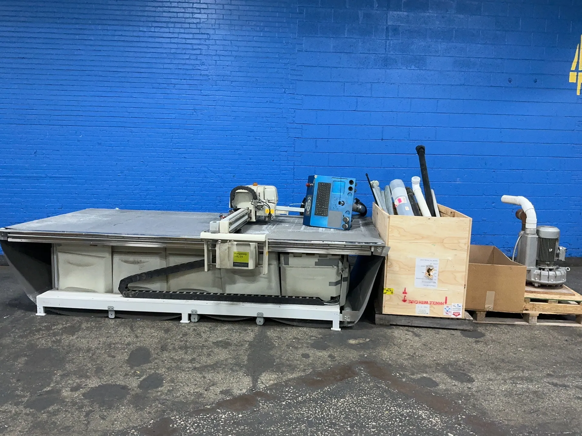 Image for Kongsberg #I-XL-24, fabric cutter, 68" x 148" capacity, 74" x 148" table, vacuum pump, belt conveyor, pedestal controls, 6.6 KW, 200-280/346-480 V.