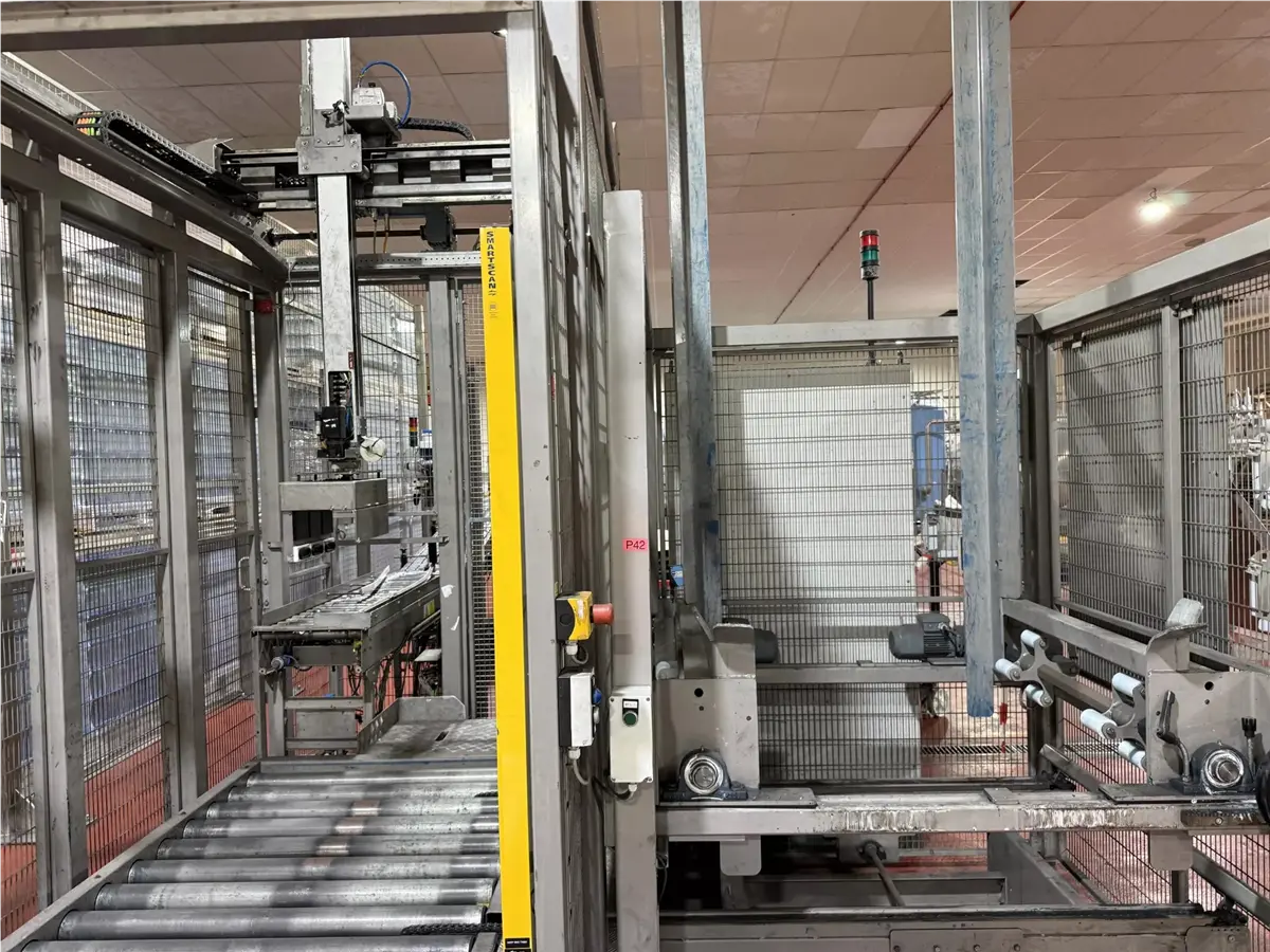 Palsys #P-40, case palletizer, w/ 3 roller conveyors & chain transfer, 230/400 V.
