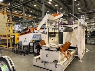 40000 lb, Feed-Lease reel coil line, 66" wide, 9-roll straightener