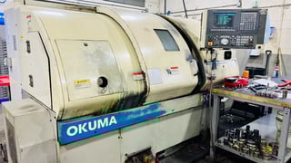 Okuma #762S-BB, CNC big bore lathe, 21.6" swing, 10" chuck, 4-jaw, 3" bar, 22.3" centers, 12 station, OSP CNC