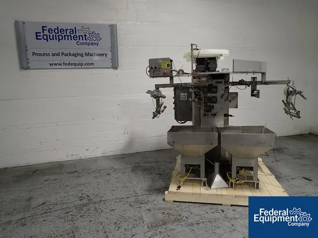 Wrap-Ade #UPH8-12, veritcal dose packer, 12" wide seal area, dual vibrating feeders, Stainless Steel hoppers