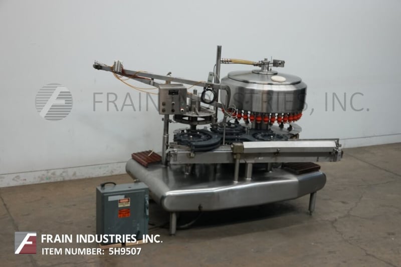 Federal #3612, automatic, Stainless Steel, 36 head rotary, pressure gravity filler and 16 head rotary capper