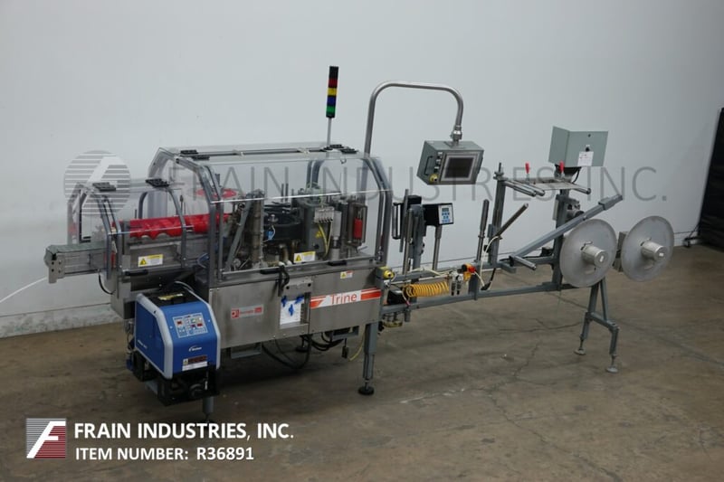 Trine #4650, Stainless steel, roll fed, hot melt glue labeler designed to apply full or partial wrap labels