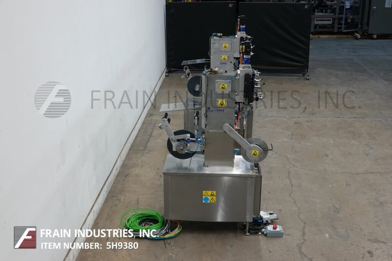 Fords Packaging Systems 220, twin head free standing capping presses