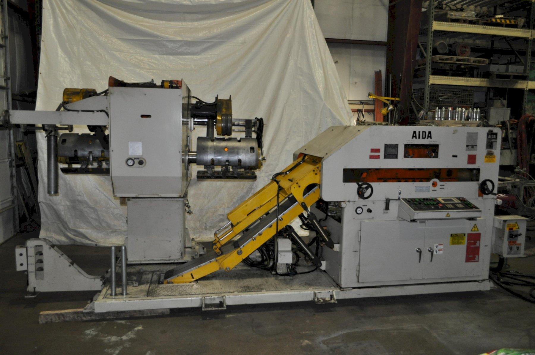 6600 lb. Aida #LFG-600R(1), space saver coil feed line 18.11" x .125" stock, 55" OD, 16"-20" ID, 7-roll