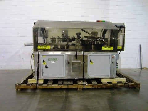 Trine #4700, Roll Fed Hot Glue Labeler, 3000 containers/min., 1.75"-5" diameter Bottle capacity, used for 1