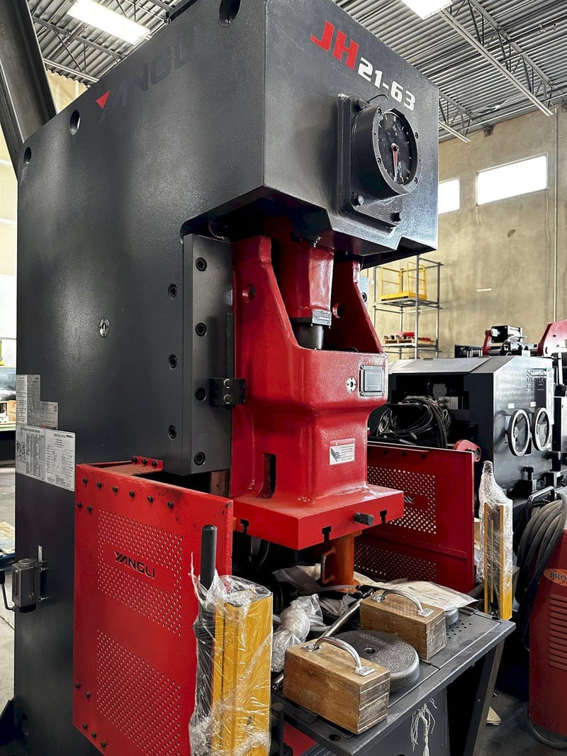 63 Ton, Yangli #JH21-63, OBI press, 4.72" stroke, 11.81" die height, 3.15" adj., 70 SPM, 47" OD, 18"-20" ID