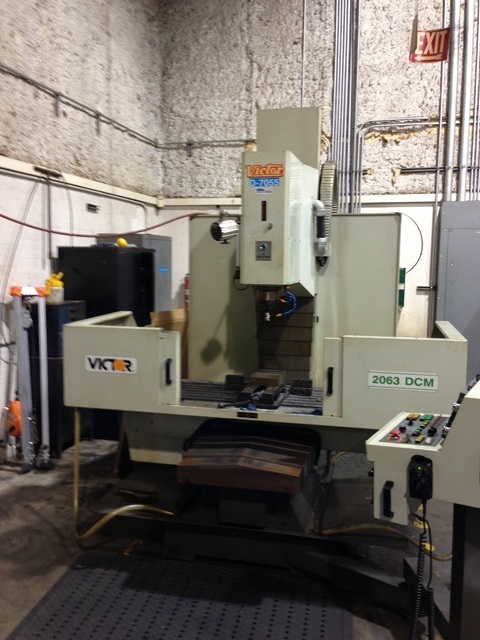 Victor #2063DCM, vertical machining center, 50" X, 25" Y, 24" Z, 20" x63"table,Fanuc 20-FA, 6000 RPM,CT40,20