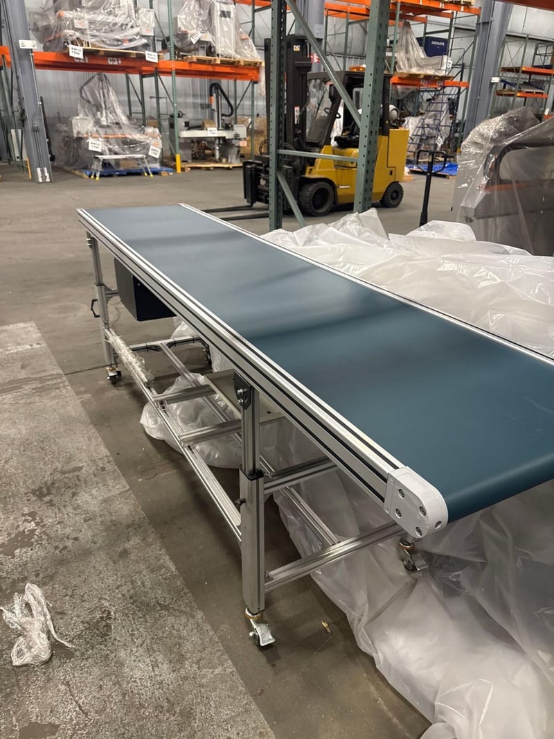 24" wide x 10' long, AMC conveyor, extruded & anodized aluminum frame, indexing functionality w/vari-speed