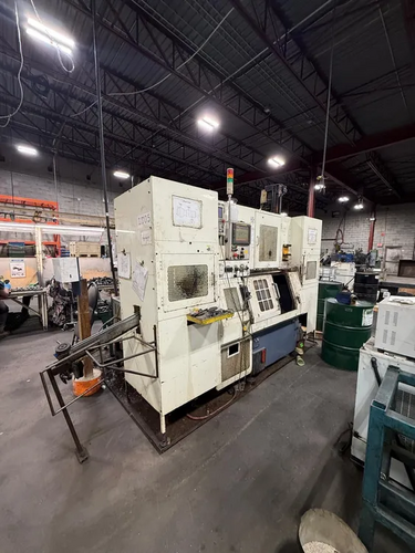 Fuji #FS-4, Cnc Lathe, w/ robot loader, 4000 RPM, 10/15 HP, 8" chuck, Fanuc 21I-TB cnc, 11.8" stroke, 2005
