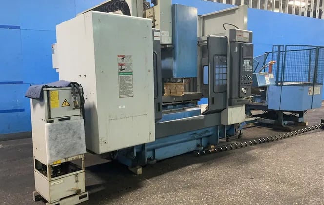 Mazak #MTV-515/40N, CNC vertical machining center, 22" x 52", 30 tool changer, rotating table, 2001