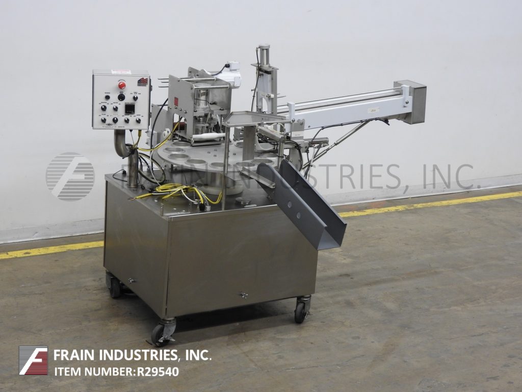 World Cup 1232, automatic, 12 pocket rotary cup filler, sealer, lidder, 12 pocket 30" rotary