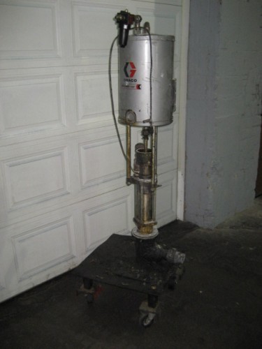 Graco #Bulldog, Piston Pump, stainless steel, 1.5" inlet, 2" outlet, Air operated, On cart with casters - Image 1