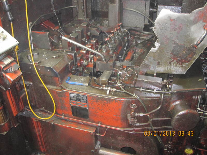 National #164, 4 die high speed nut former, 200 PPM, air clamping on feed rolls, 1988 - Image 1