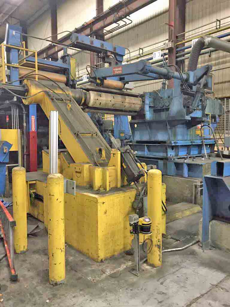40000 lb. Stamco, uncoiler, 60" width, 100" O.D., 16"-20" ID, overarm holddown, slide base, 100 HP DC motor - Image 1