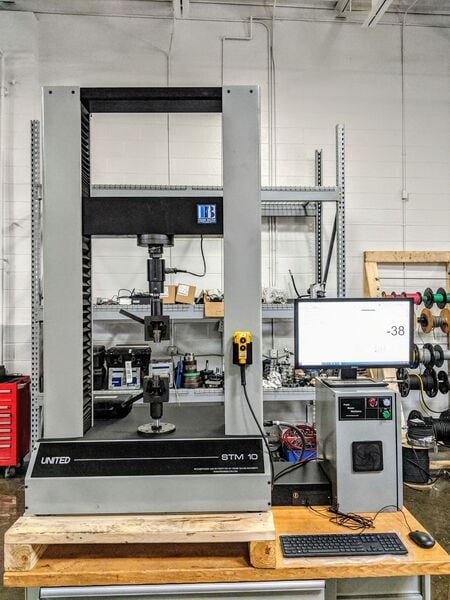 10000 lbf. (50kN) United #STM-10, 42" tension & compression testing opening, 42" stroke, 22" x 6" table - Image 1