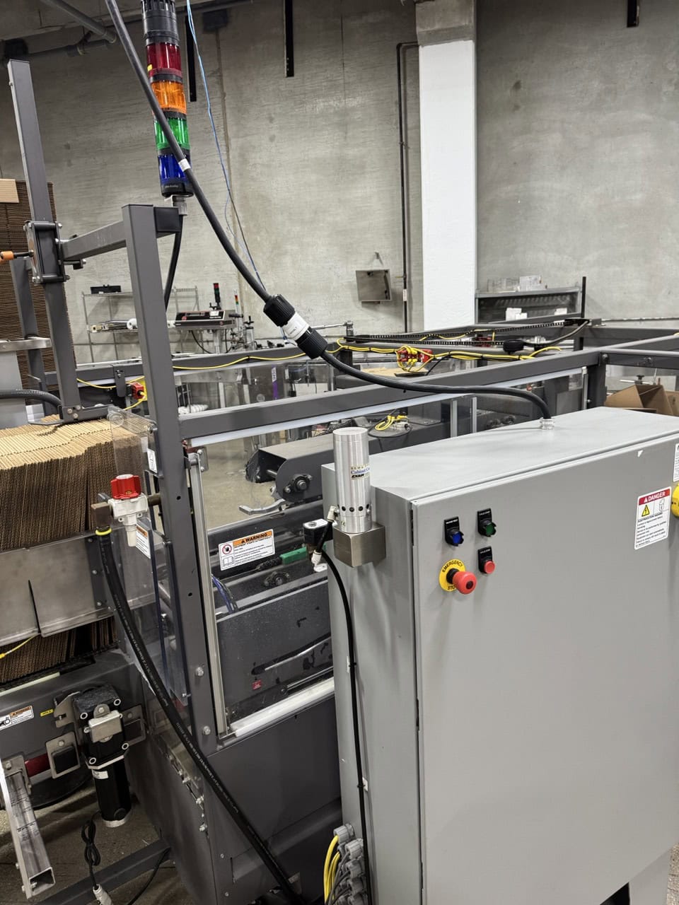 Pearson Packaging Systems, complete packaging system, made up of box erector, robot, palletizer & unscrambler - Image 1