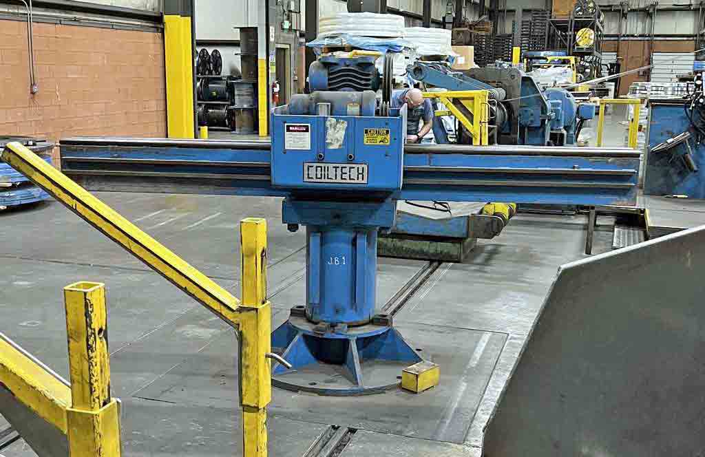 20000 lb. Coiltech, 2-arm turnstile, 36" capacity, C-hook type arms, powered pushoff, manual rotation - Image 1