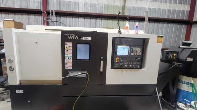 Hyundai Wia #HD2200, 2-Axis CNC Lathe, 22.2" machining length, 15" turning diameter, 8" chuck, chip conveyor - Image 1