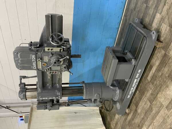 4' -9" Carlton #0A, radial arm drill, 53" x 31" base area, power elevation, coolant, box table, 5 HP - Image 1