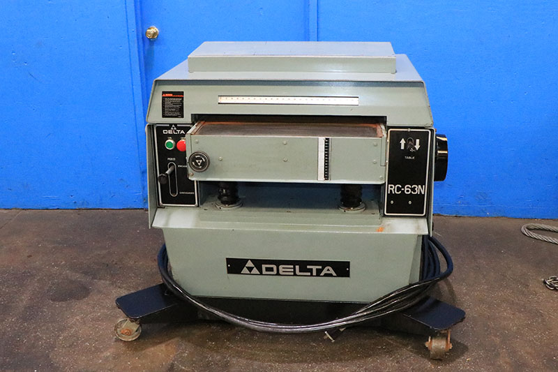 24" x 9" Delta #RC63-63N, woodworking planer, 25" x 35" table, 20-60 FPM, spiral / helical cutting head - Image 1
