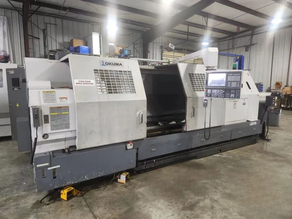 Okuma #LB-35II, CNC lathe, 27" swing, 6" bar, 20" chuck, 118" centers, 18" turning diameter, 12 station - Image 1