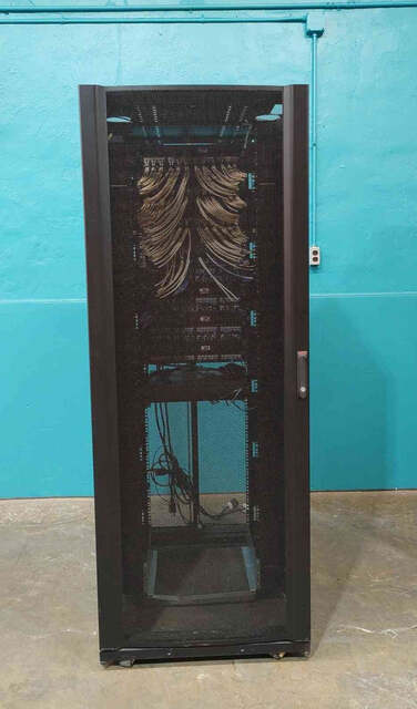 APC NetShelter SX #AR3150, 42U Wide Server Rack Enclosure, Populated Patch Panels - Image 1