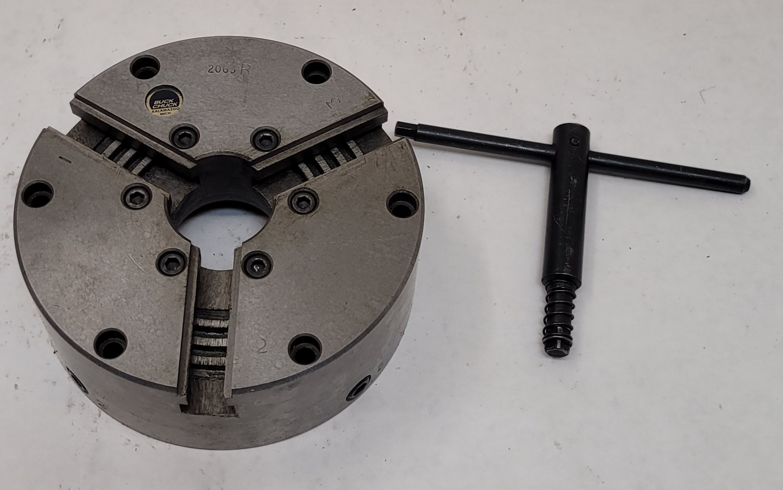 6" Buck #2063R, 3-jaw self-centering scroll lathe chuck, flat back, 1-1/2" thru hole, 3000 RPM, w/ chuck key - Image 1