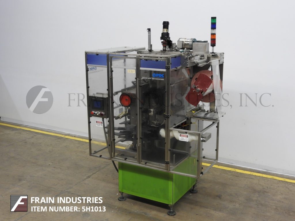 PDC #F-200, automatic neck bander, rated from 10-100 containers per minute - Image 1